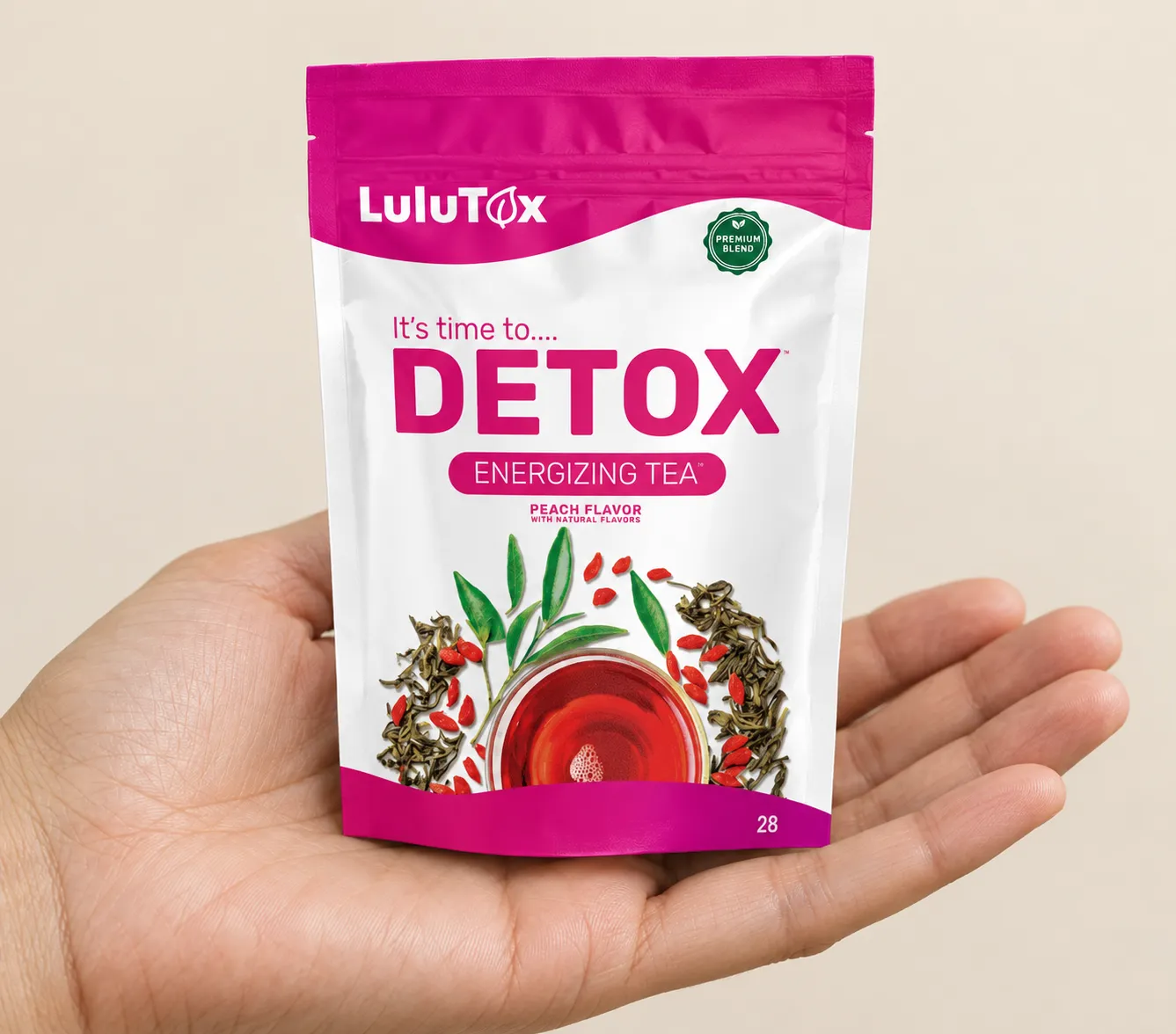 Lulutox Detox Tea HCTC — the package held in a hand
